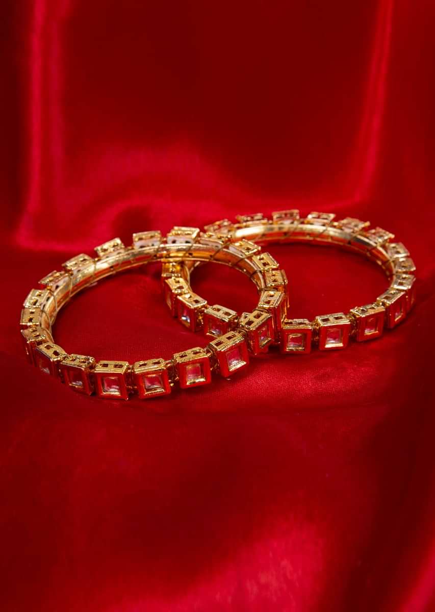 Gold plated pair of kadas adorn with princess cut kundan stone only on kalki