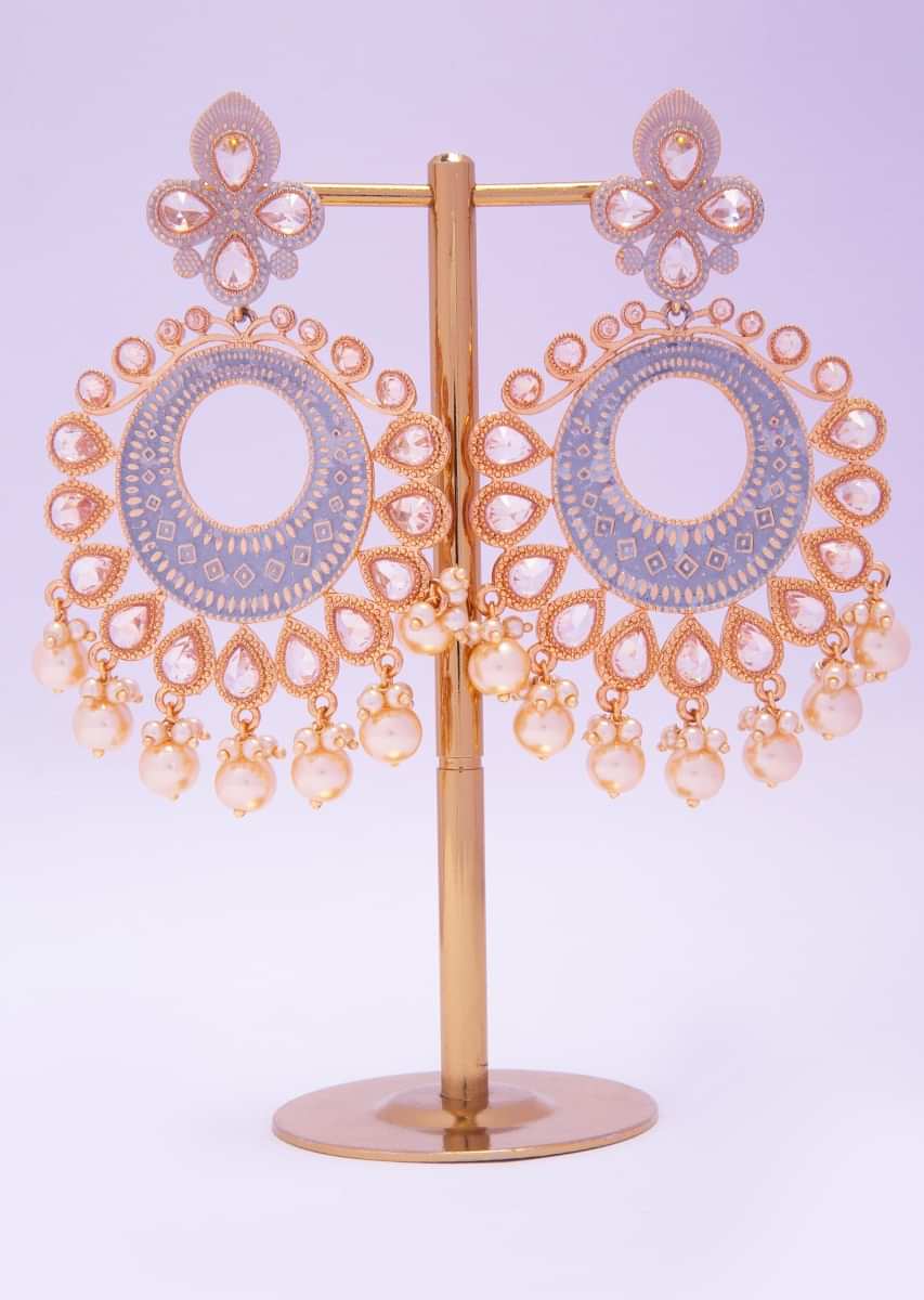 Gold plated self carved traditional earring adorn with crystal beads and dark cream pearls  only on kalki