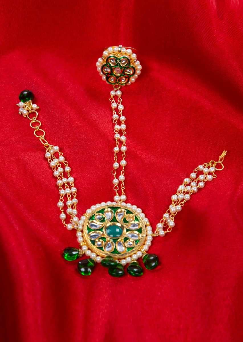 Gold played ring and detached bracelet adorn with green beads, moti and kundan only on Kalki