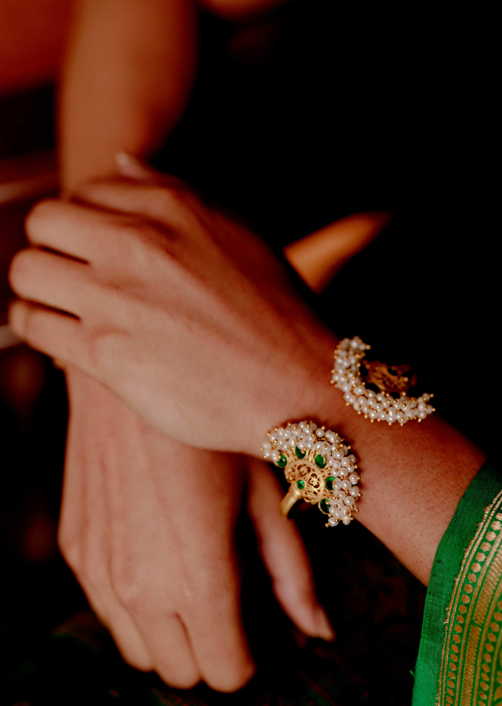 Gold Plated Bracelet With Green Cz And Pearls In Floral Motifs On Both Sides By Zariin