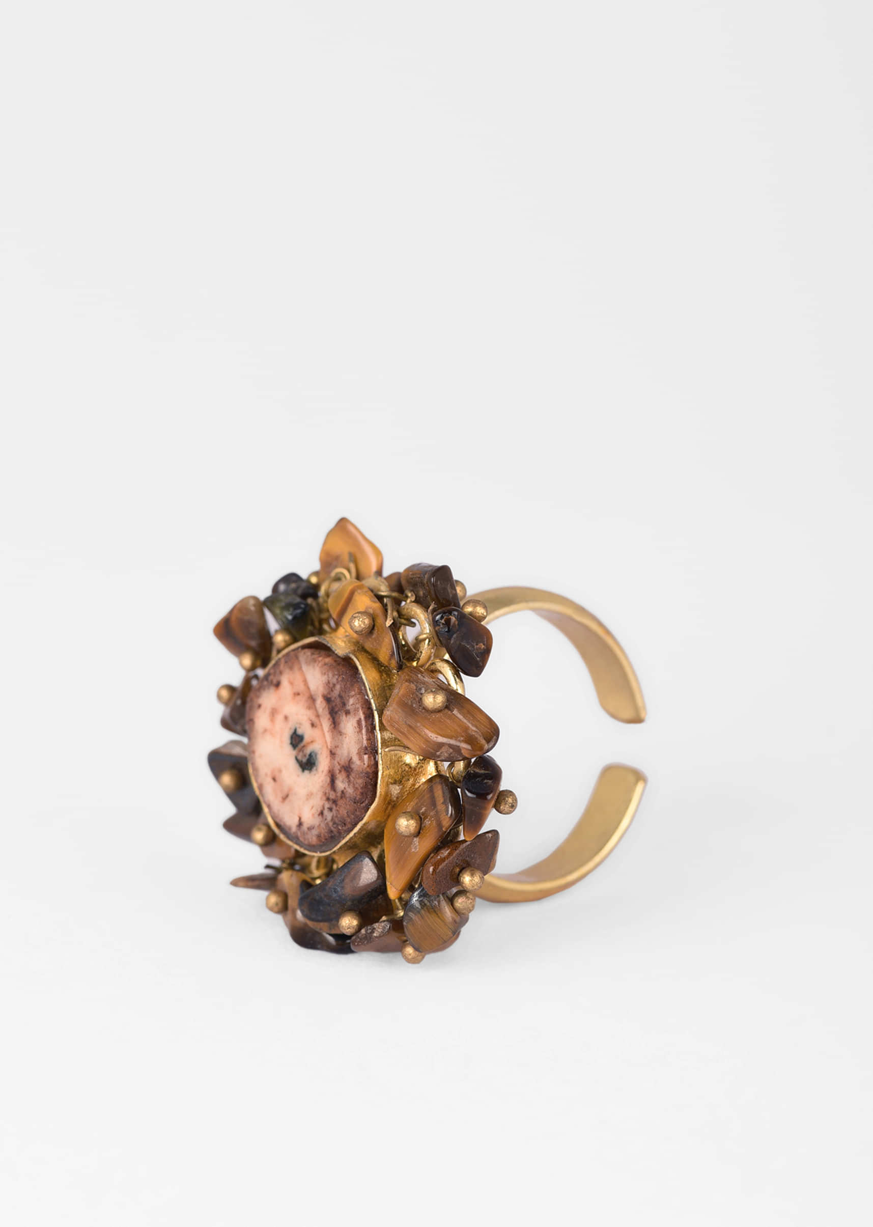 Gold Plated Ring With A Brown Semi Precious Stone Centre And Tiny Stone Pieces All Over 