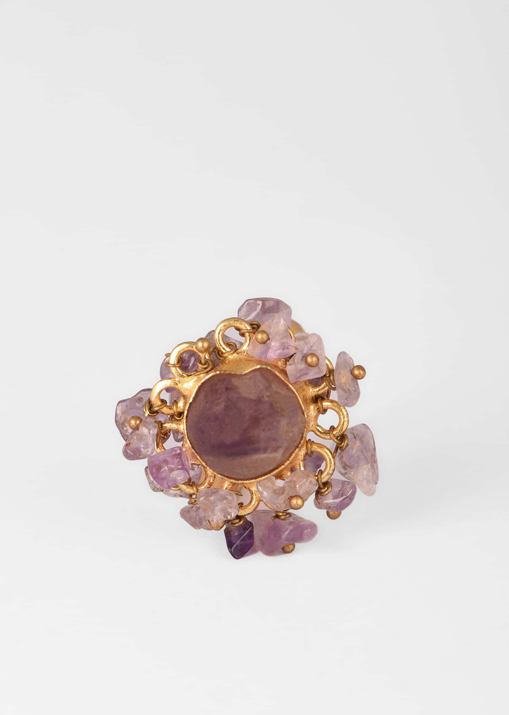 Gold Plated Ring With A Pale Purple Semi Precious Stone Centre And Tiny Stone Pieces All Over 