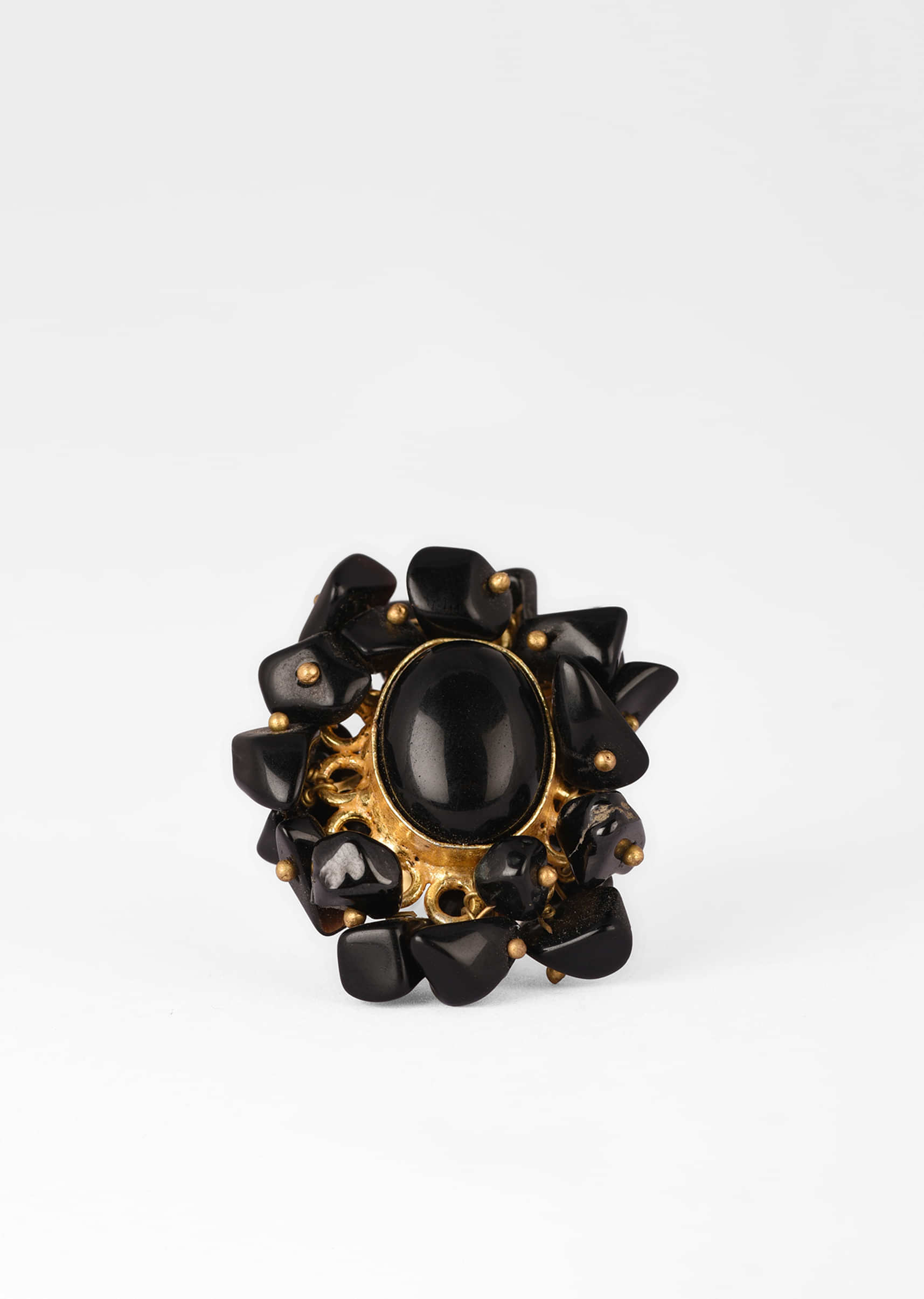Gold Plated Ring With An Oval Black Semi Precious Stone Centre And Tiny Stone Pieces All Over 