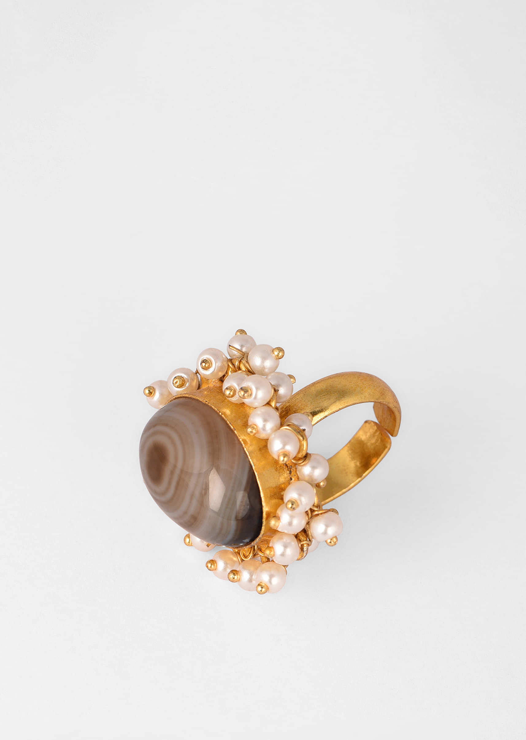 Gold Plated Ring With An Oval Shaped Grey Semi Precious Stone And Moti Tassels 