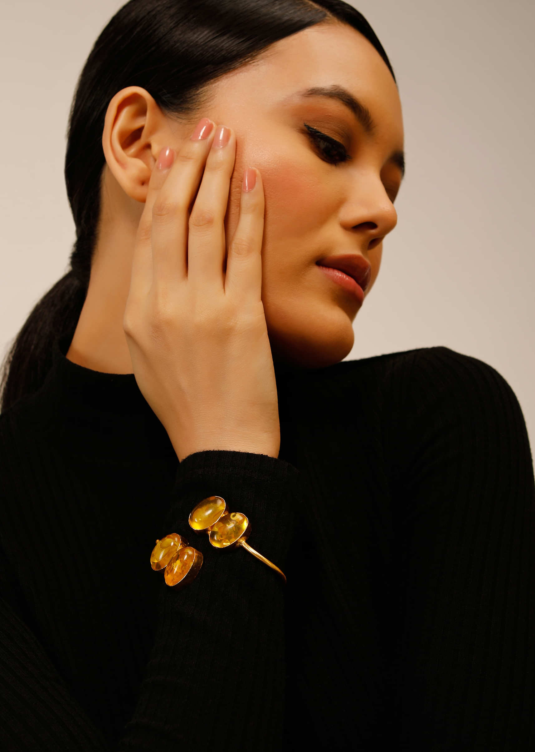 Gold Plated Wrap-Around Bangle With Oval Shaped Yellow Colored Semi Precious Stones 