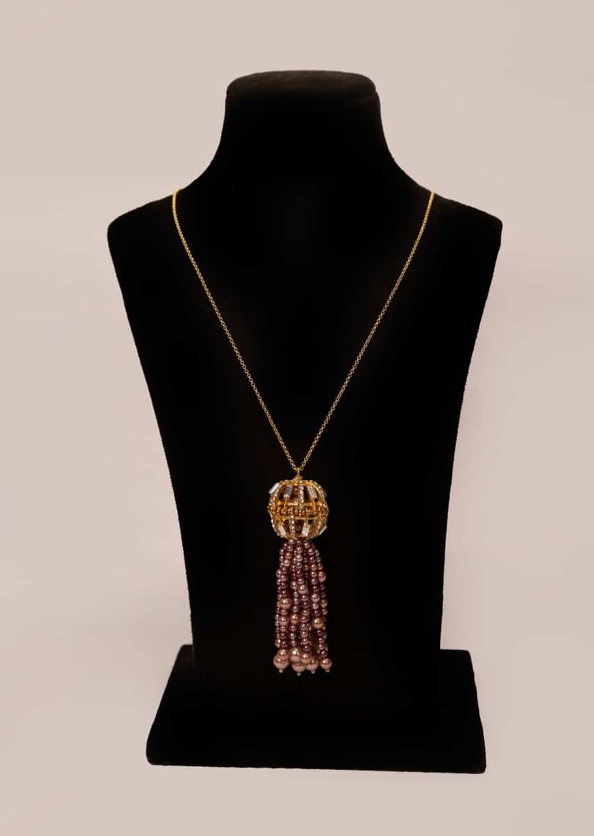 Golden chain necklace with an oval cut out broach with moti, stones and buggle beads