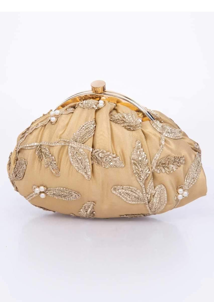 Golden clasp closure fabric clutch embellished in lace and pearl only on Kalki