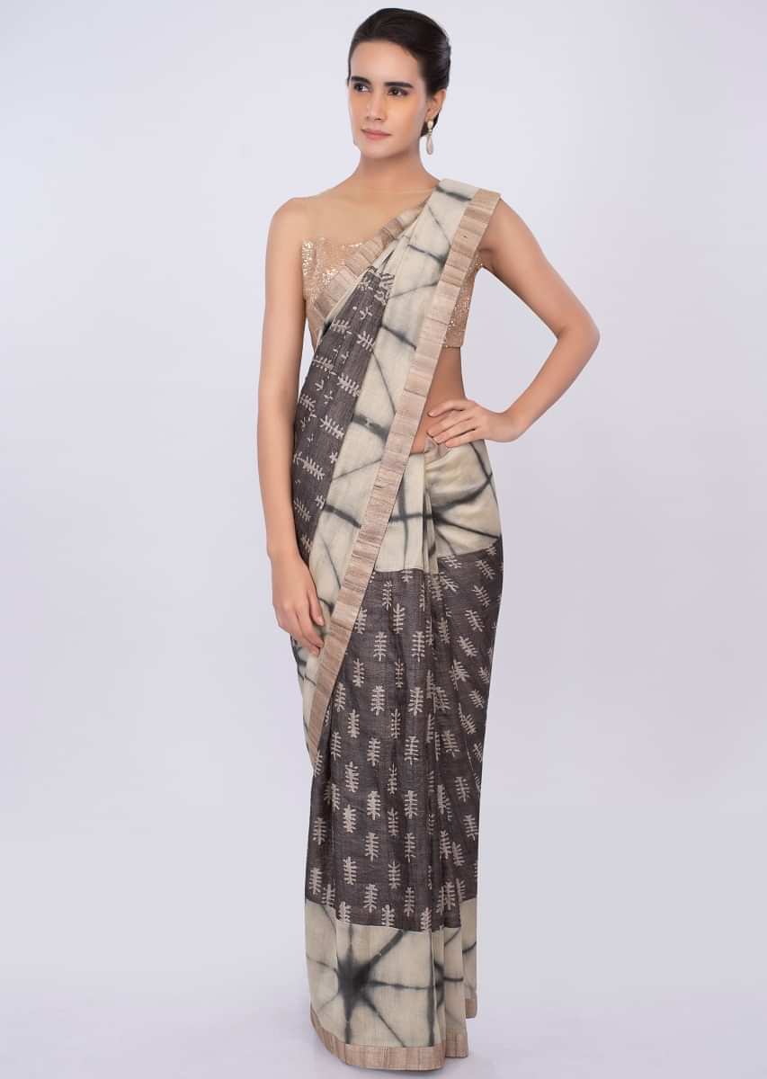 Graphite grey and luminary cream shaded batik print saree only on kalki