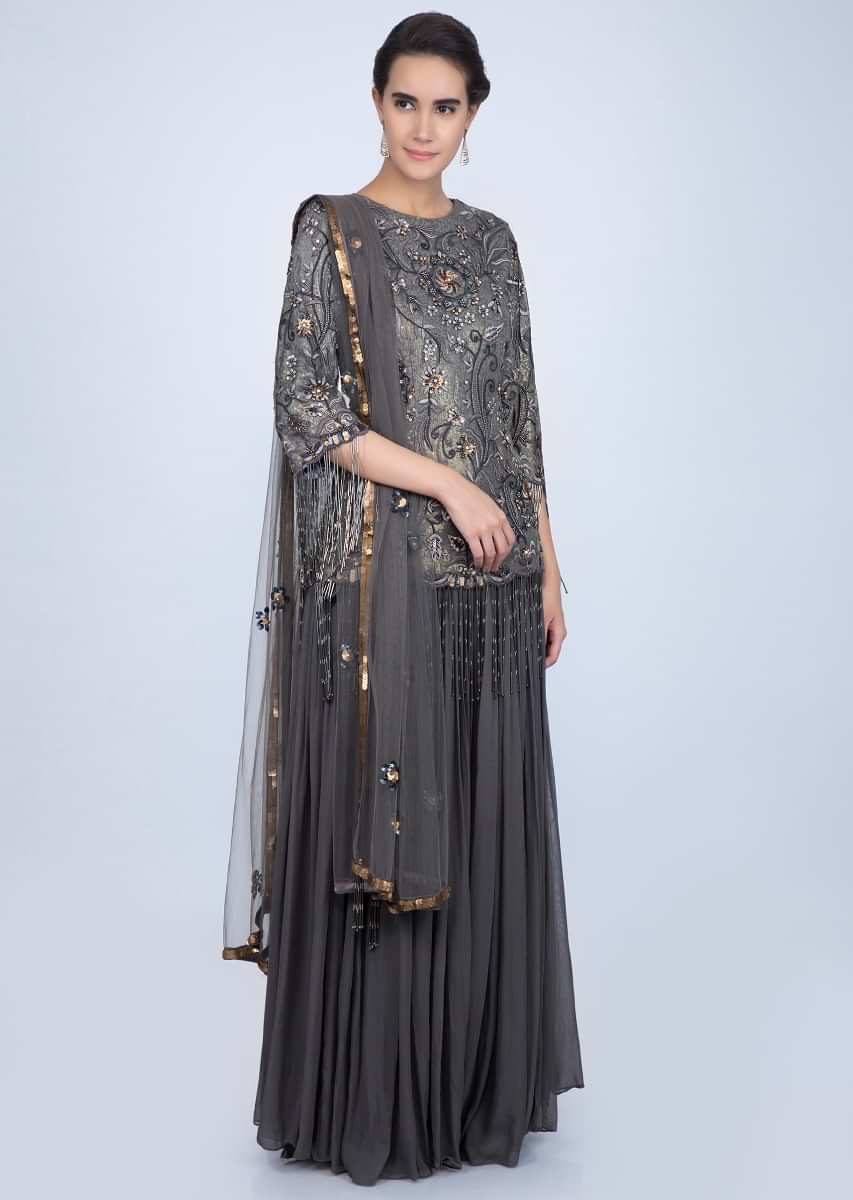 Graphite grey palazzo paired with heavy embellished suit with tasseled sleeves only on Kalki