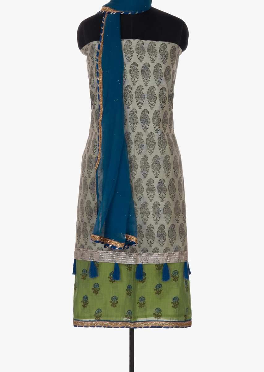 Green and light ivory double layered unstitched suit paired with blue bottom and dupatta