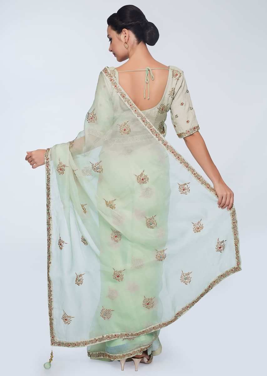 Green organza saree with embroidered butti and border 