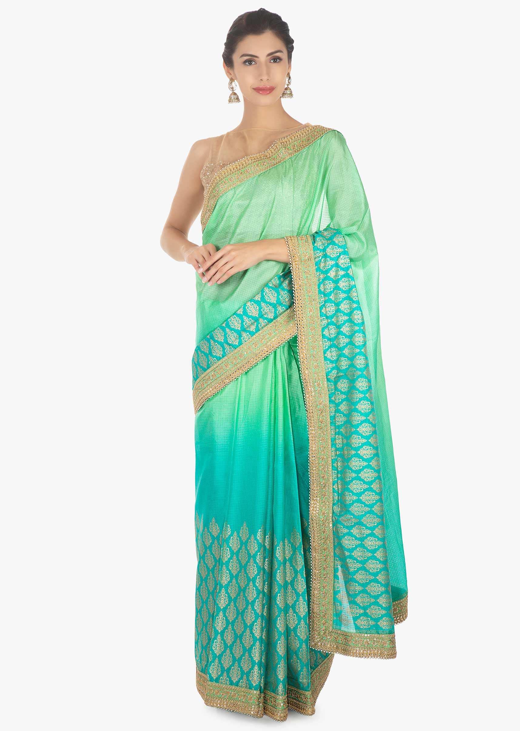 Green shaded  kotta silk saree with weaved hemline