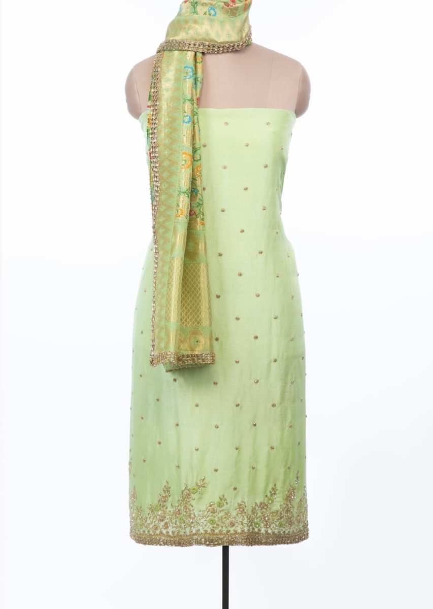 Green unstitched embroidered suit set with multi color weaved dupatta only on Kalki
