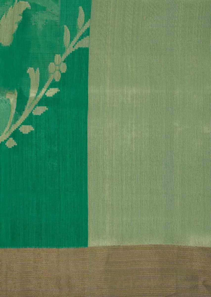 Green weaved saree in organza and raw silk fabric