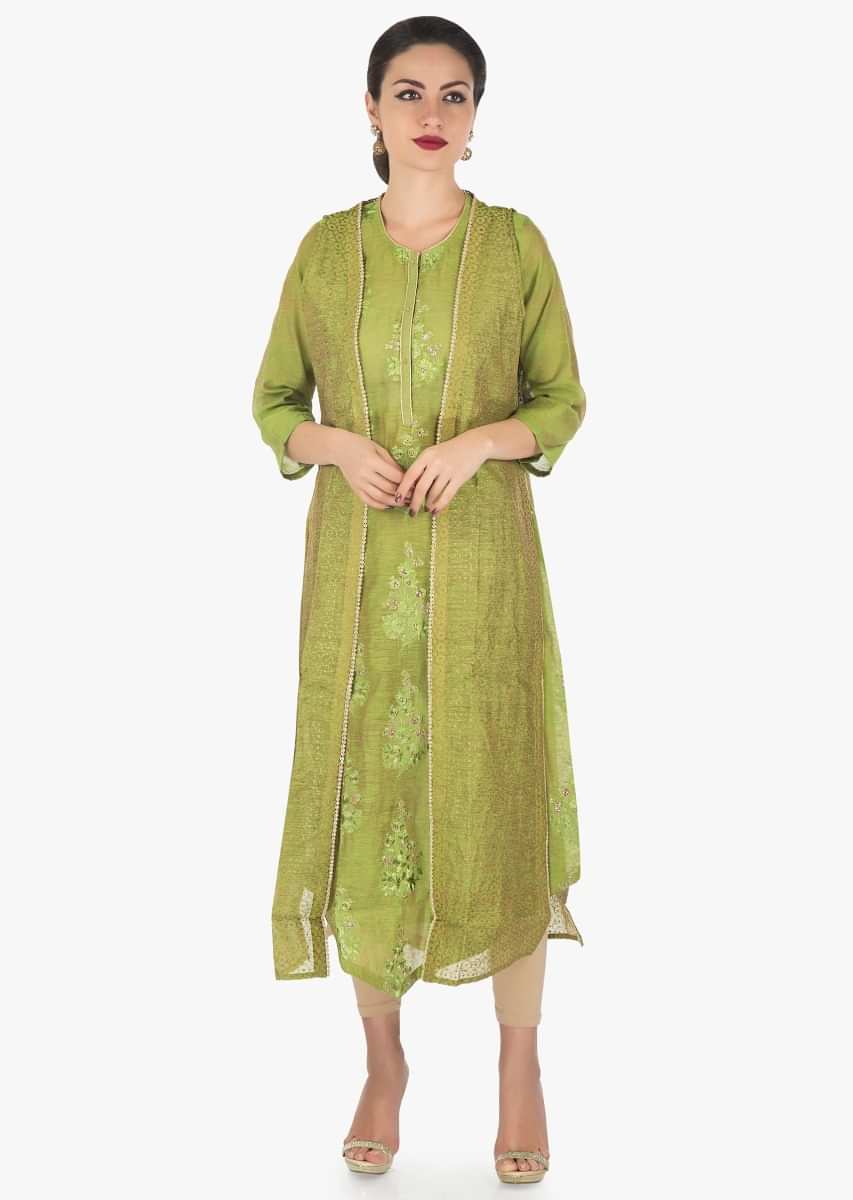 Green kurti in Tussar silk with fancy hem line in resham and zari butti only on Kalki