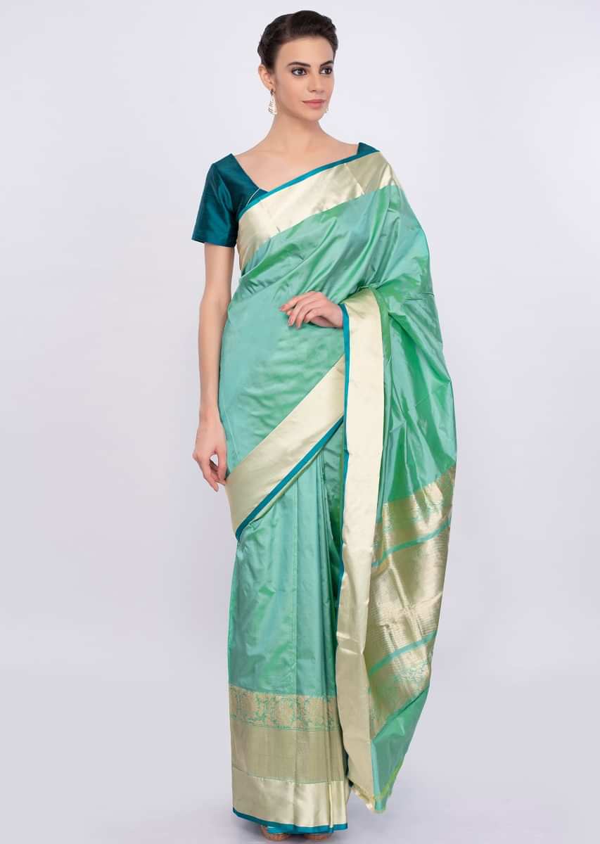 Greenish blue chanderi silk saree with brocade border only on Kalki