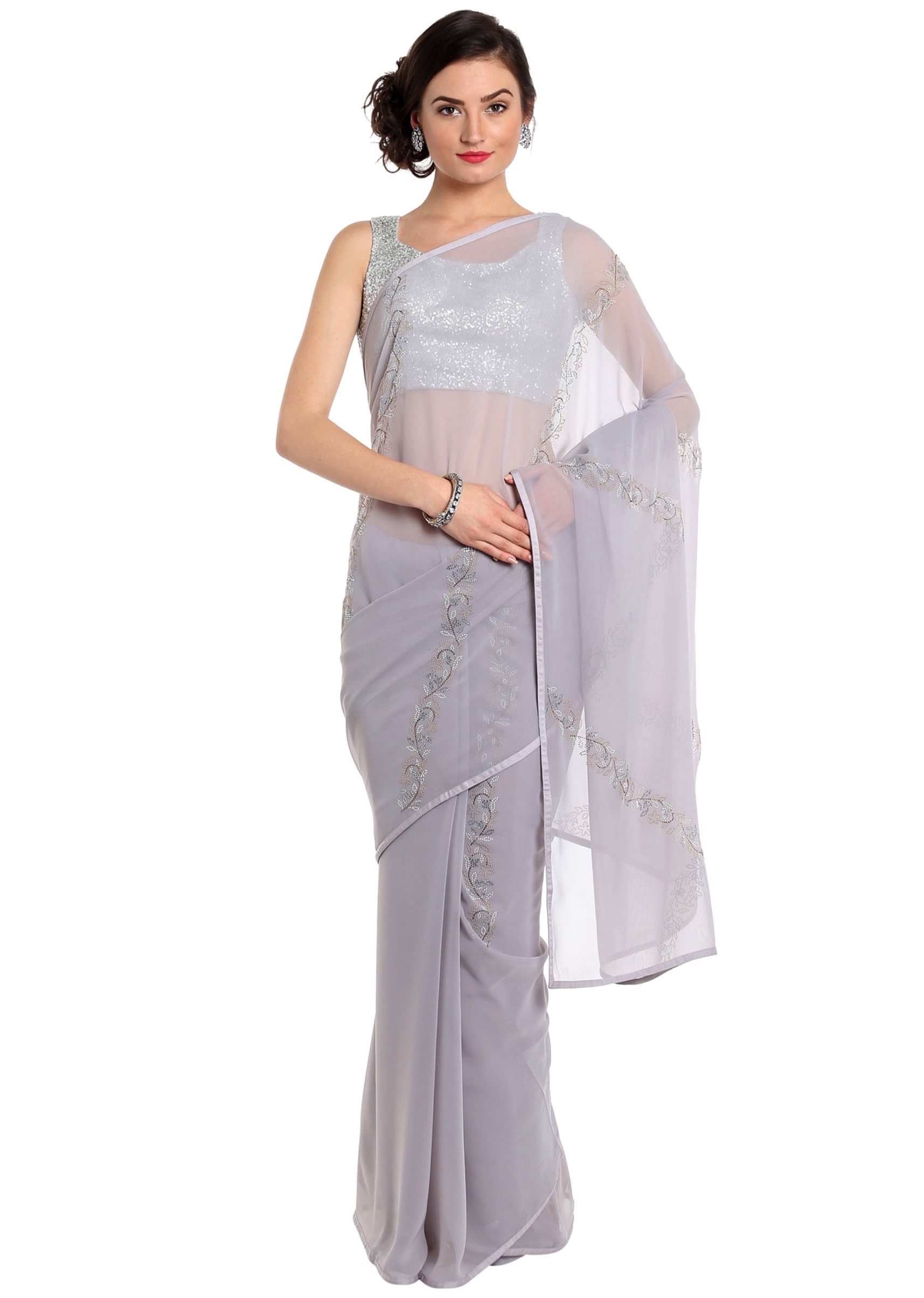 Grey saree adorn in kundan in floral motif only on Kalki