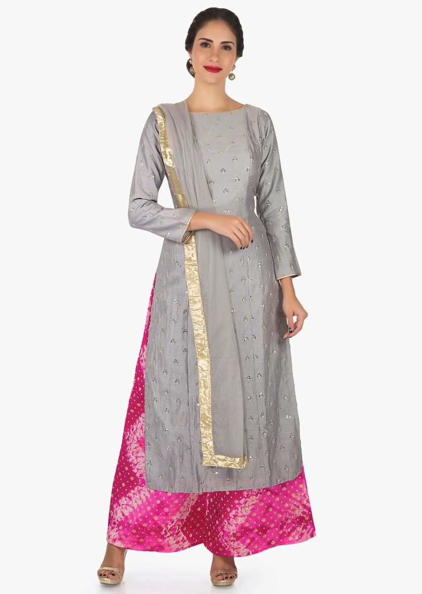 Grey and rani pink palazzo suit beautified with sequin zari butti embroidery work only on Kalki