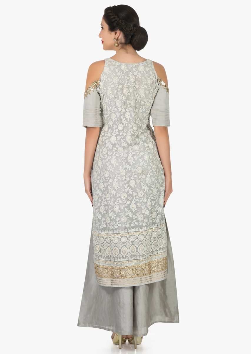 Grey cold shoulder palazzo suit adorn in thread and mirror embroidery work only on Kalki