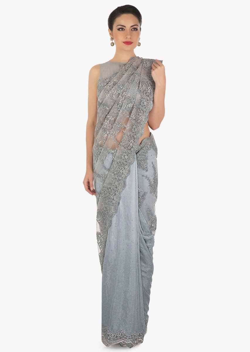 Grey half and half saree in embroidered net and silk with cut dana border