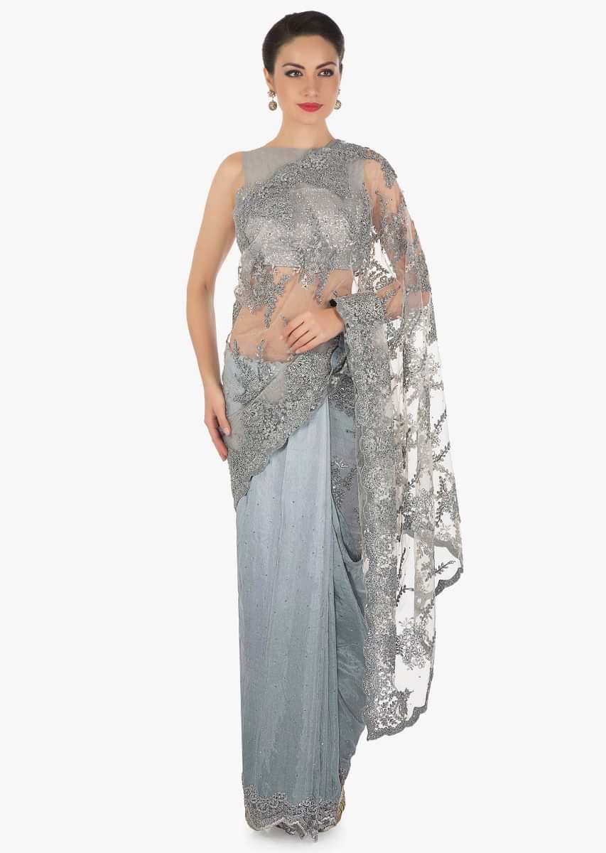 Grey half and half saree in embroidered net and silk with cut dana border