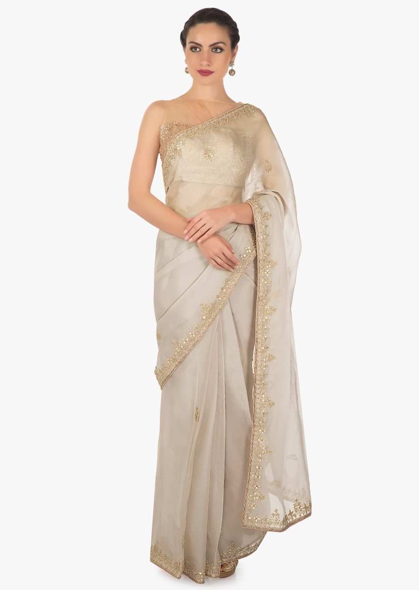 Grey tissue silk saree in gotta patch and motif embroidery only on Kalki