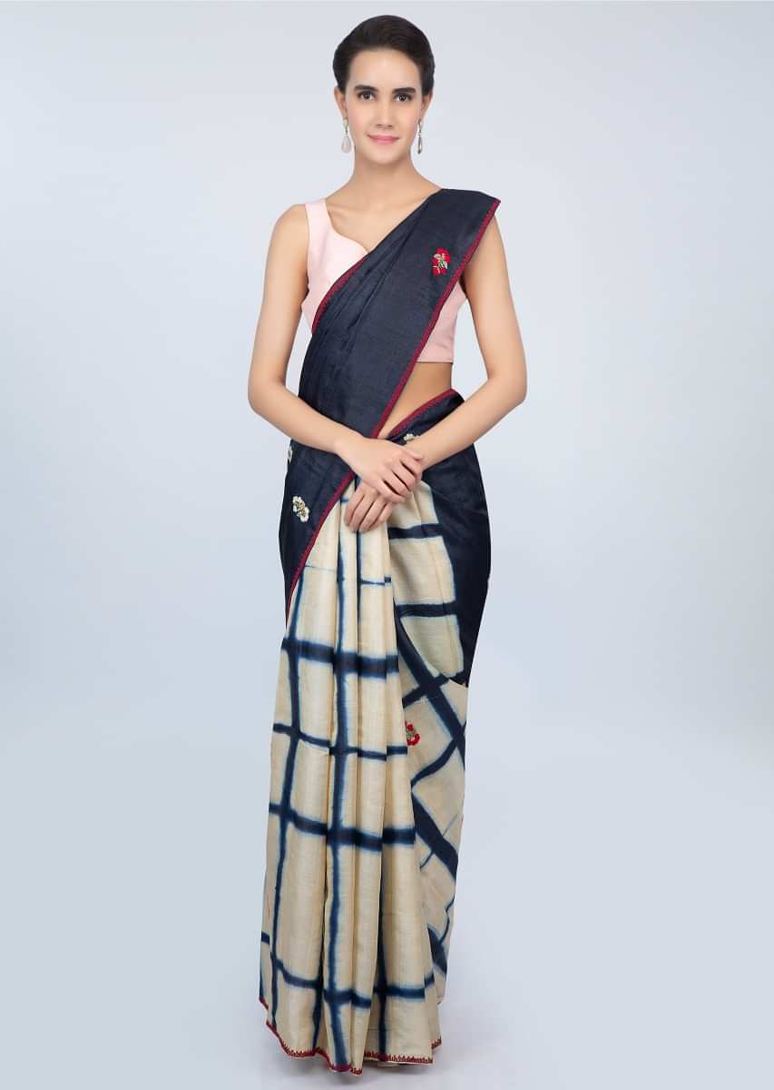 Half and tussar silk saree with batik print in checks and floral embroidered butti only on kalki