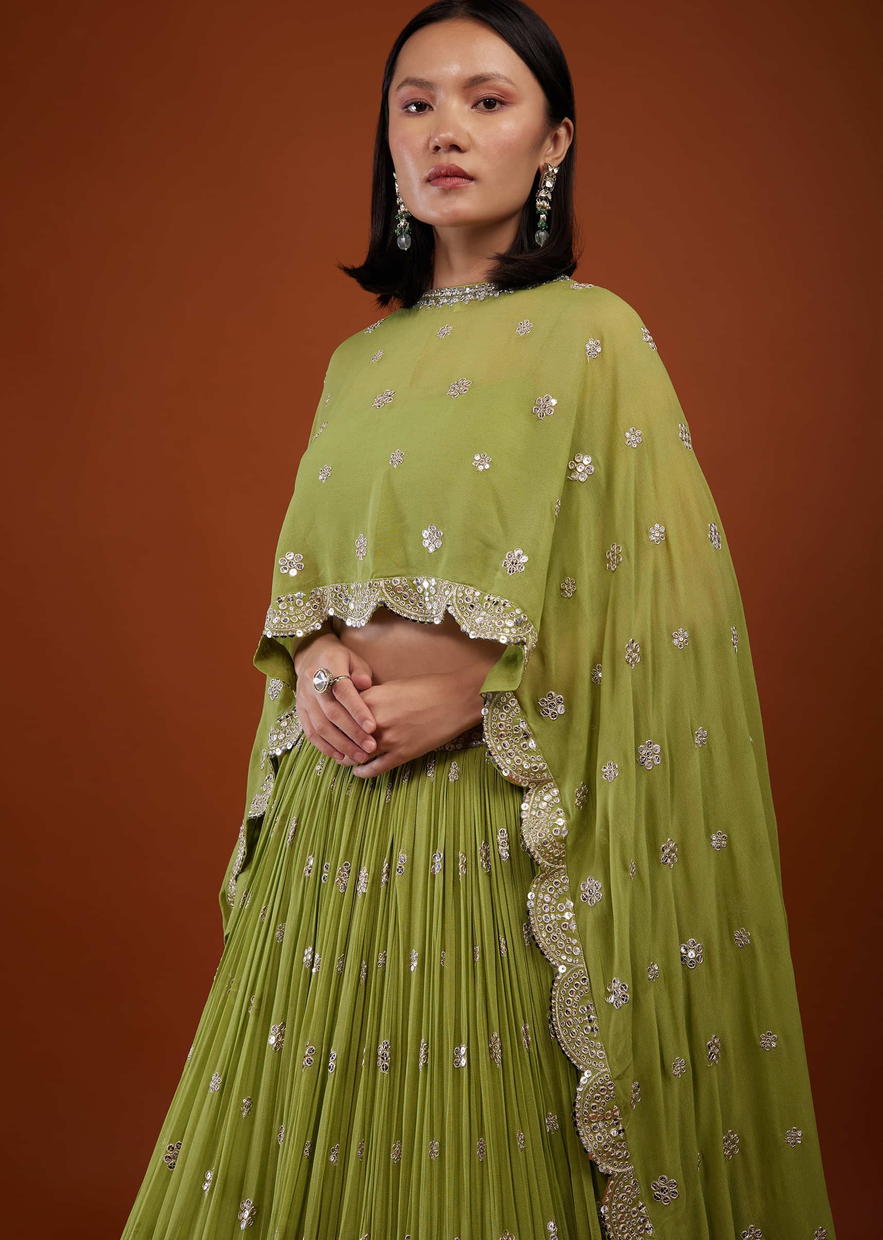 Pista Green Embroidered Lehenga In Georgette With Cape