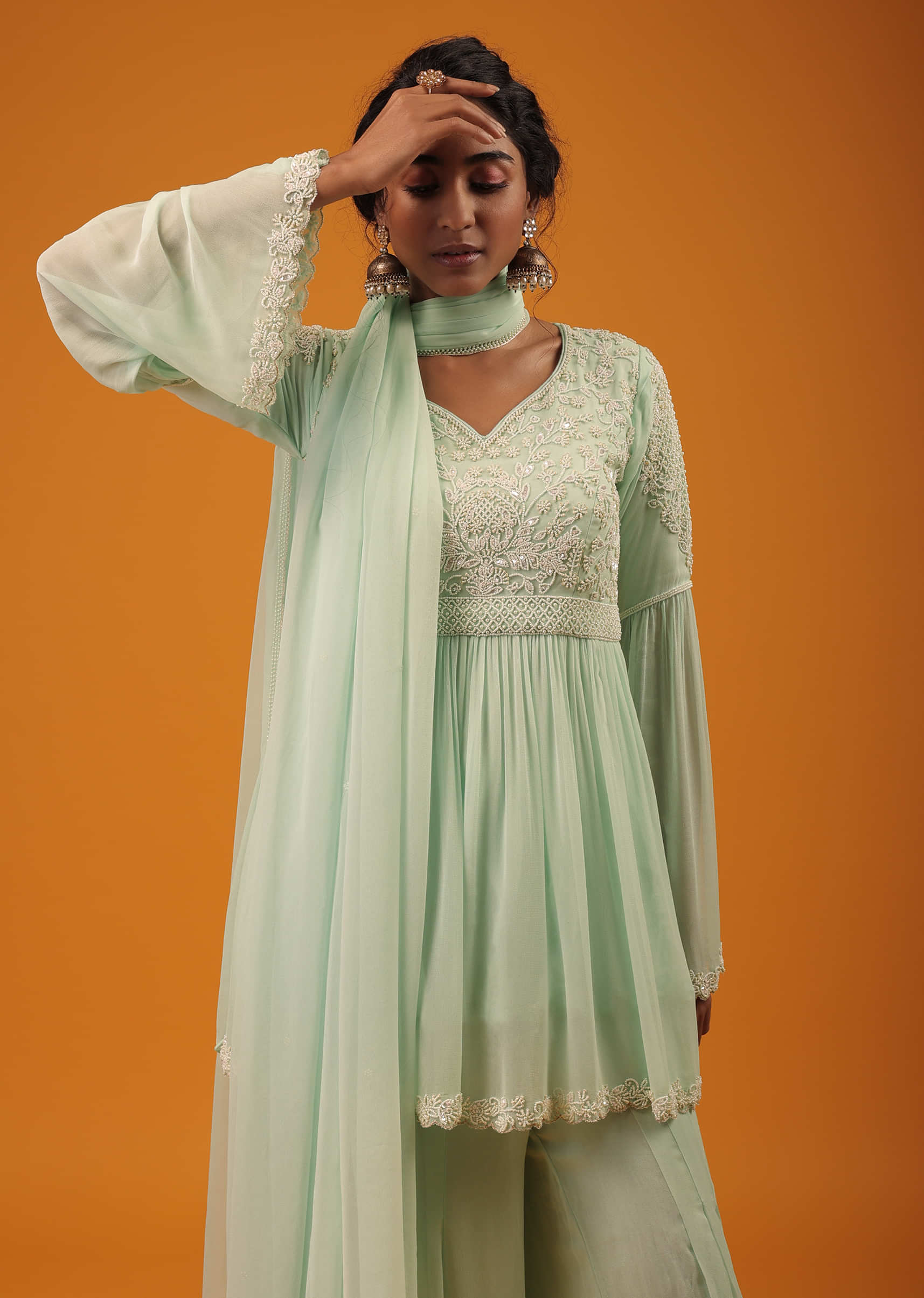 Honey Dew Green Peplum Palazzo Suit In Georgette With Intricate Moti Work And Bell Sleeves