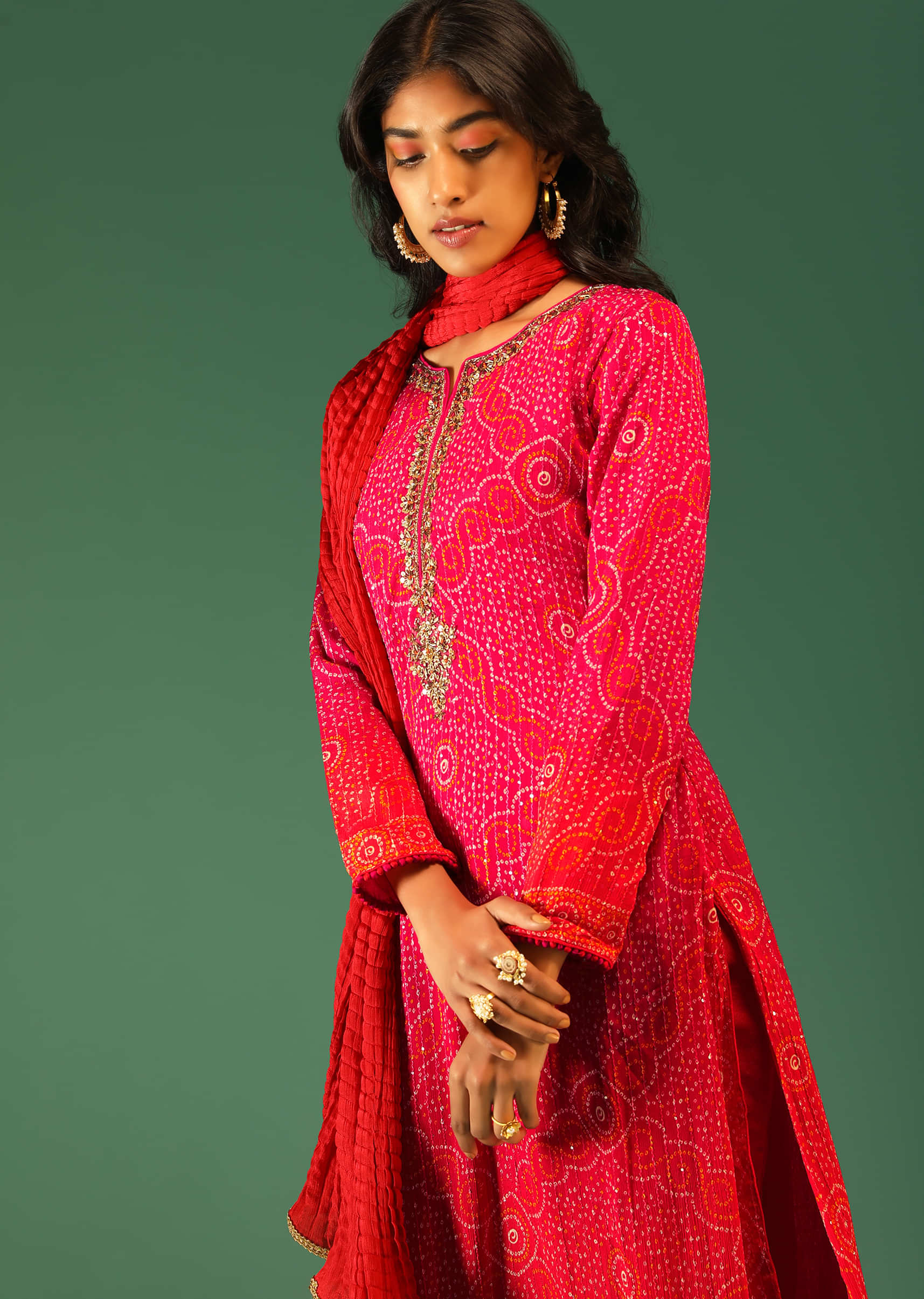 Hot Pink And Orange Shaded Straight Cut Suit In Chiffon With Bandhani Design All Over And Tassels On The Hem  