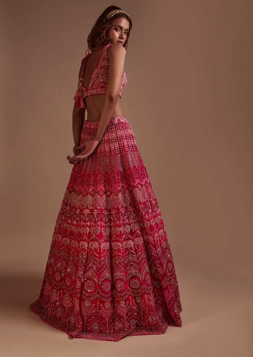 Hot Pink Lehenga Choli In Net With Mirror Work In Floral And Mughal Motifs Along With A Tassel Belt 