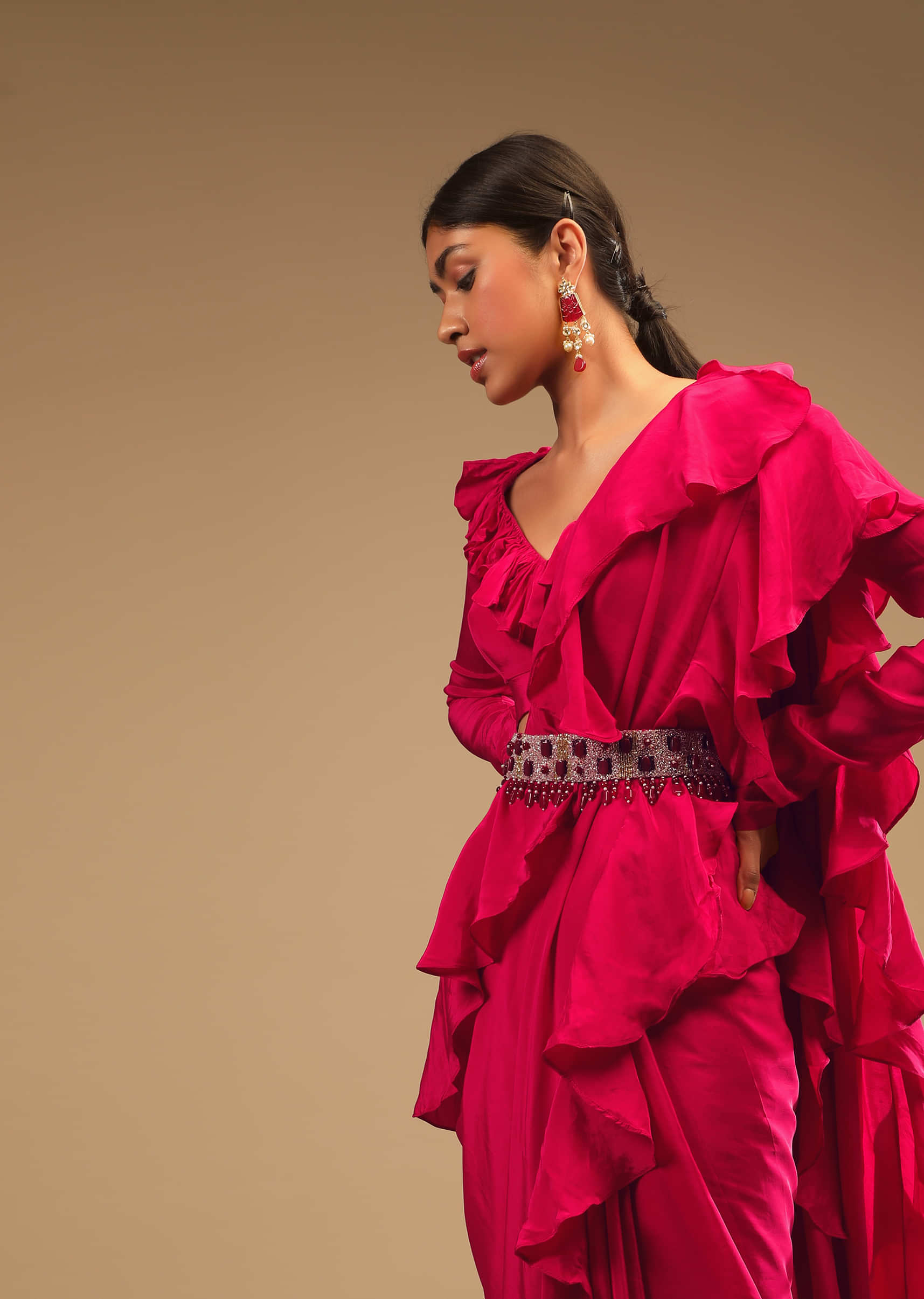 Hot Pink Saree With Ruffle Pallu, Stone Embellished Belt And A Ruffle Blouse With Side Cut Outs  