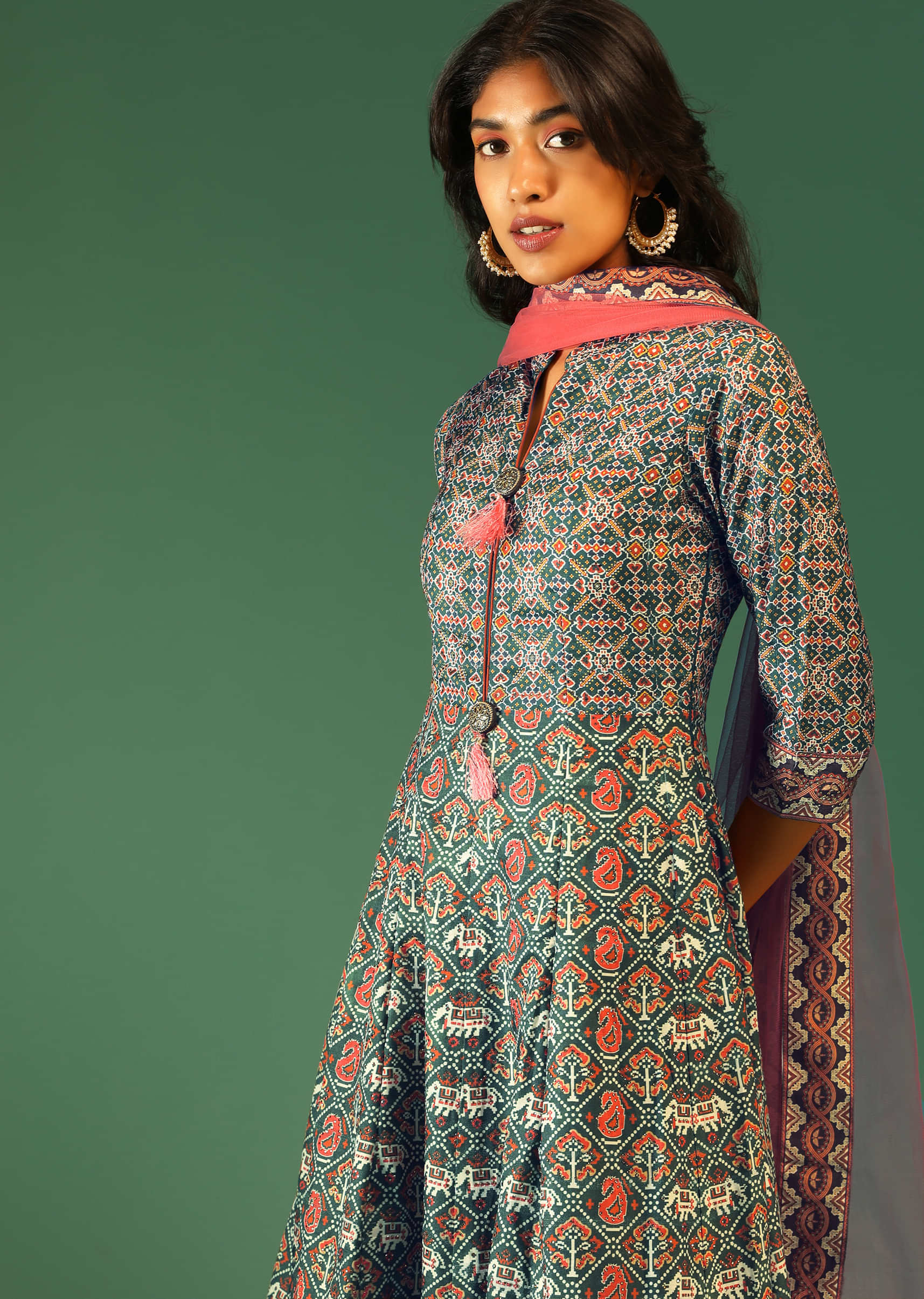 Hunter Green Anarkali Suit In Raw Silk With Patola Print And Kundan Detailing Along With A Pink Net Dupatta  