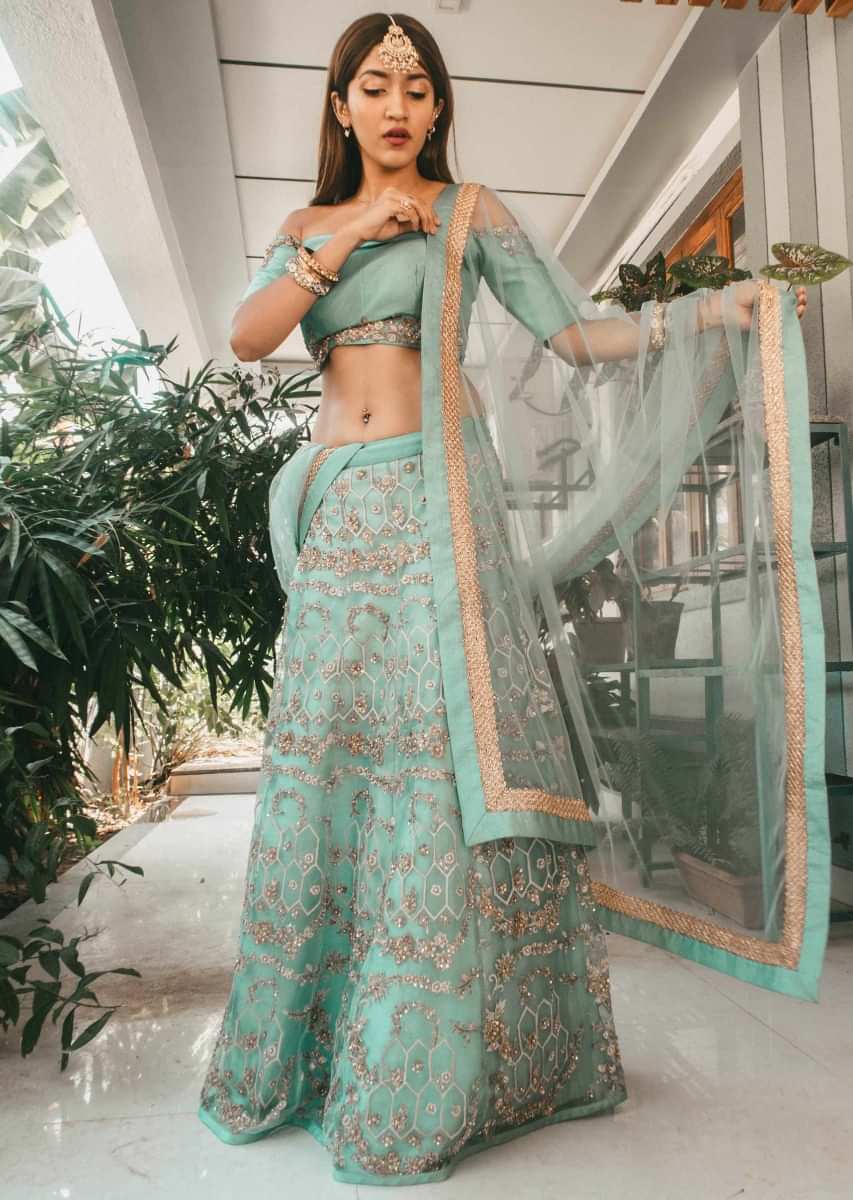 Sea green lehenga with off shoulder blouse in zari and sequin embroidery only on Kalki