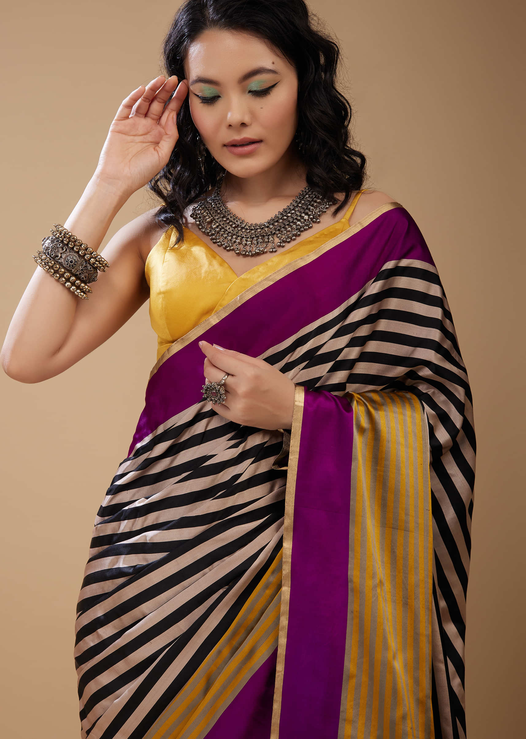 Plum Purple Satin Printed Saree With Gold And Black Stripes