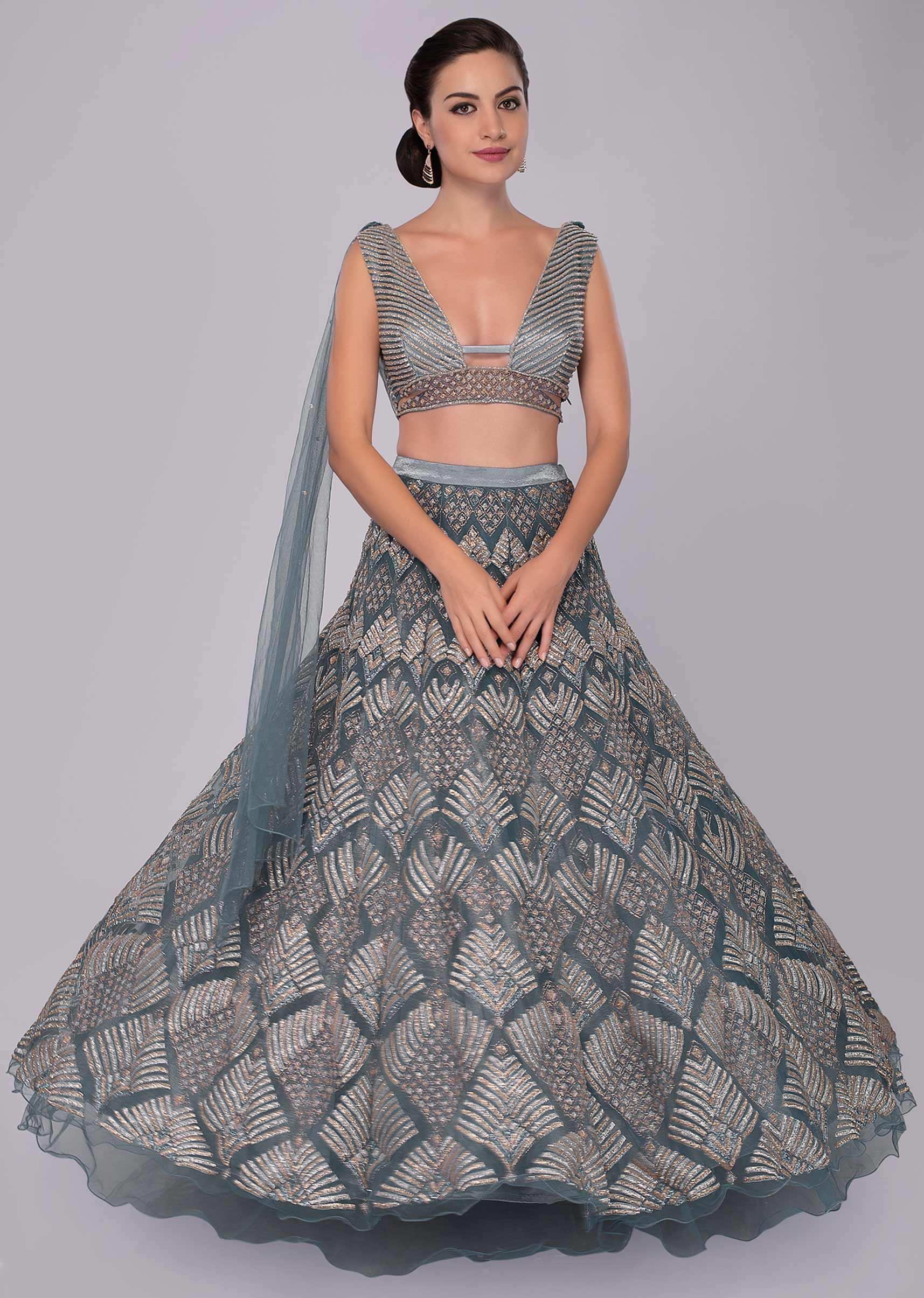 Iris blue net lehenga and blouse with  attached net  drape with side slits 