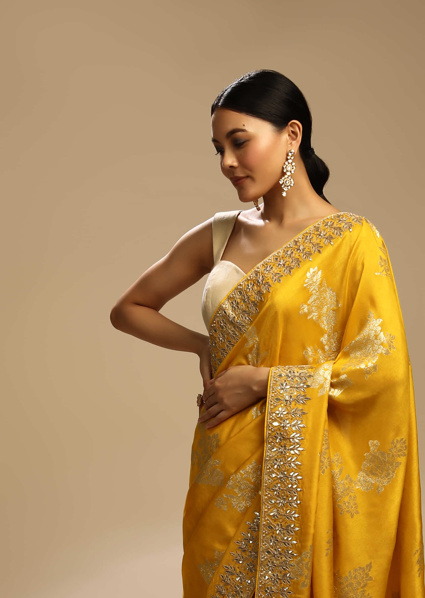 Amber Yellow Saree In Dupion Silk With Woven Floral Motifs And Gotta Embroidered Floral Border