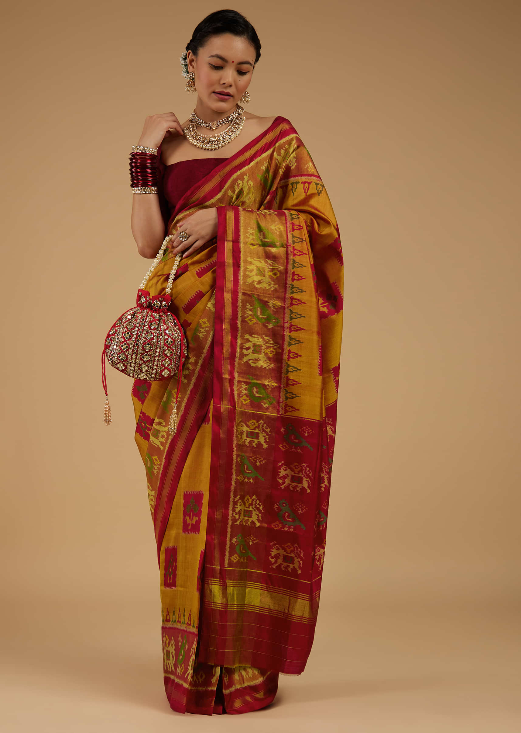 Kalki Apricot Yellow Saree In Silk With Ikat Weave Patola Work