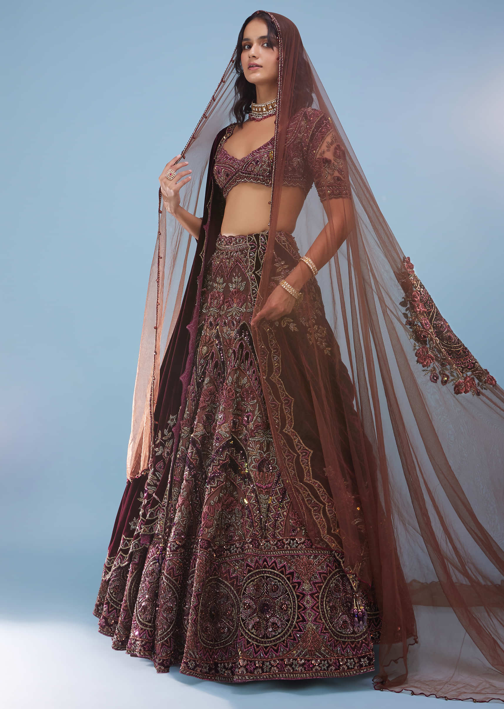 Chocolate Brown Archetypal Lehenga In Velvet Raw Silk With Heavy Embroidery And Trail - NOOR 2022