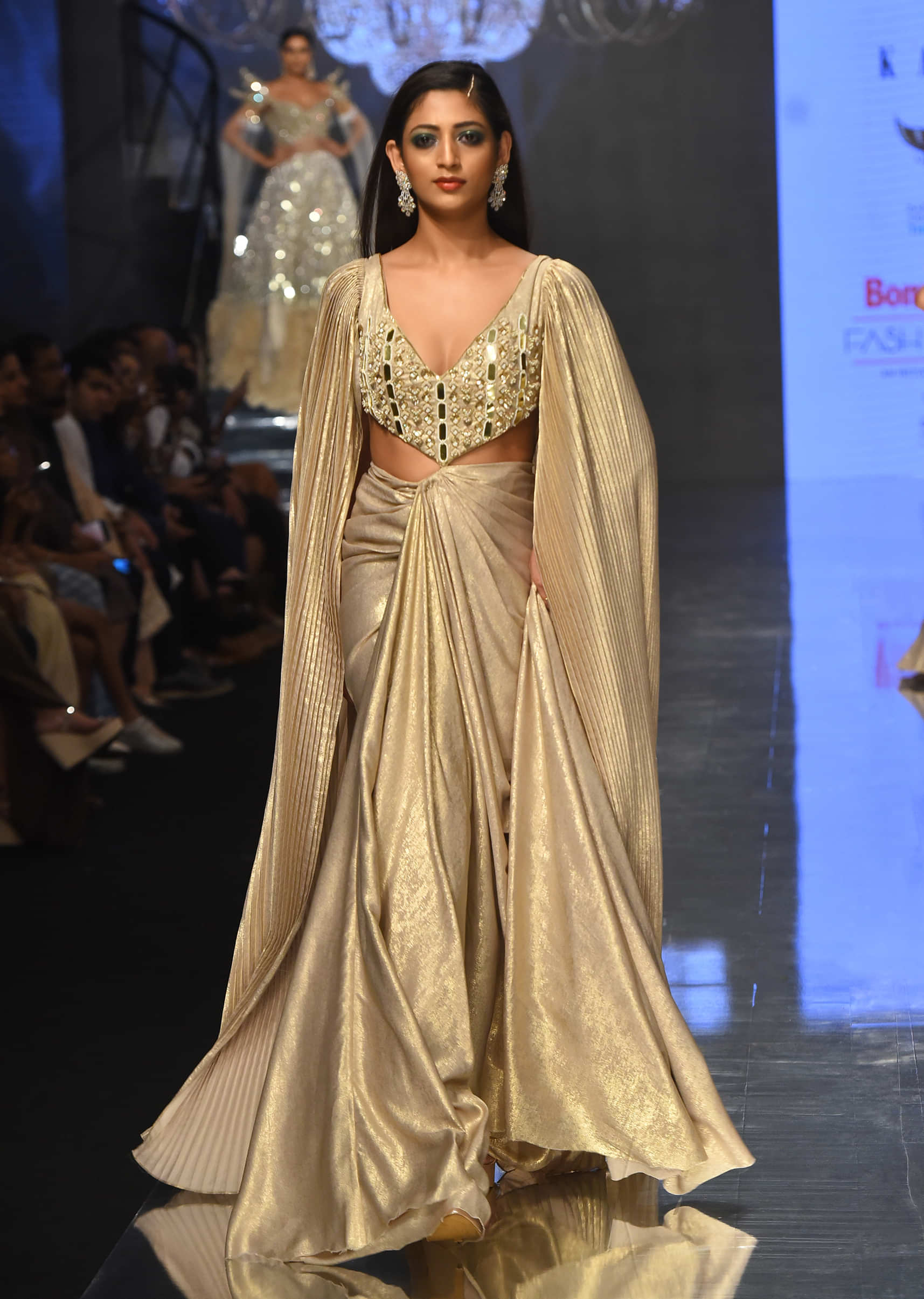 Kalki Gown With A Pre-Pleated Dhoti Skirt Area And Royal Cape Sleeves- NOOR 2022