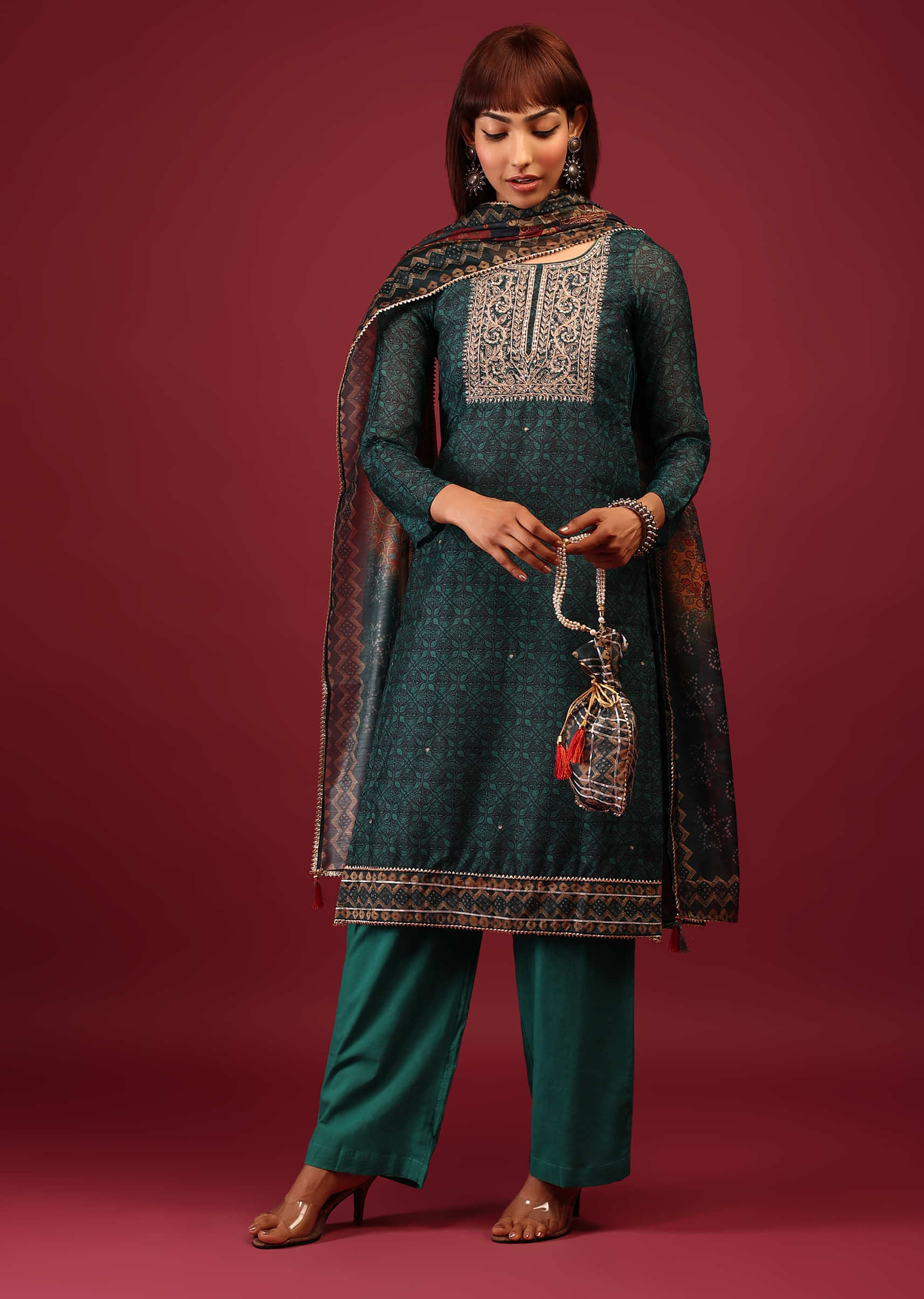 Lapis Green Palazzo Suit In Tussar Silk With A Stunning Potli Bag