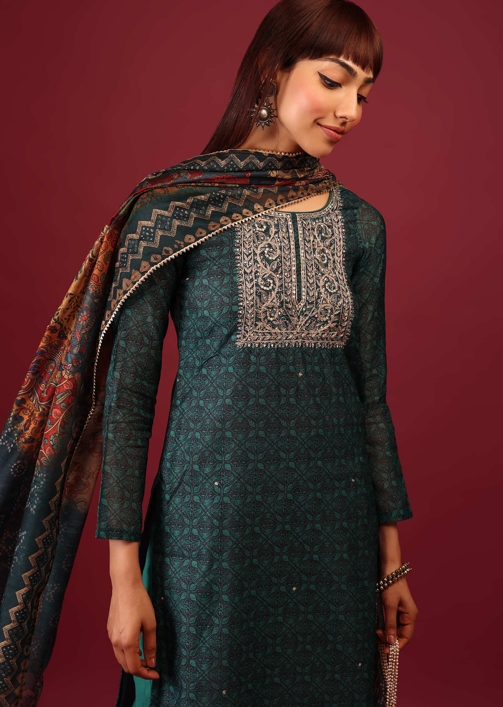 Deep Green Palazzo Suit In Tussar Silk With A Stunning Potli Bag