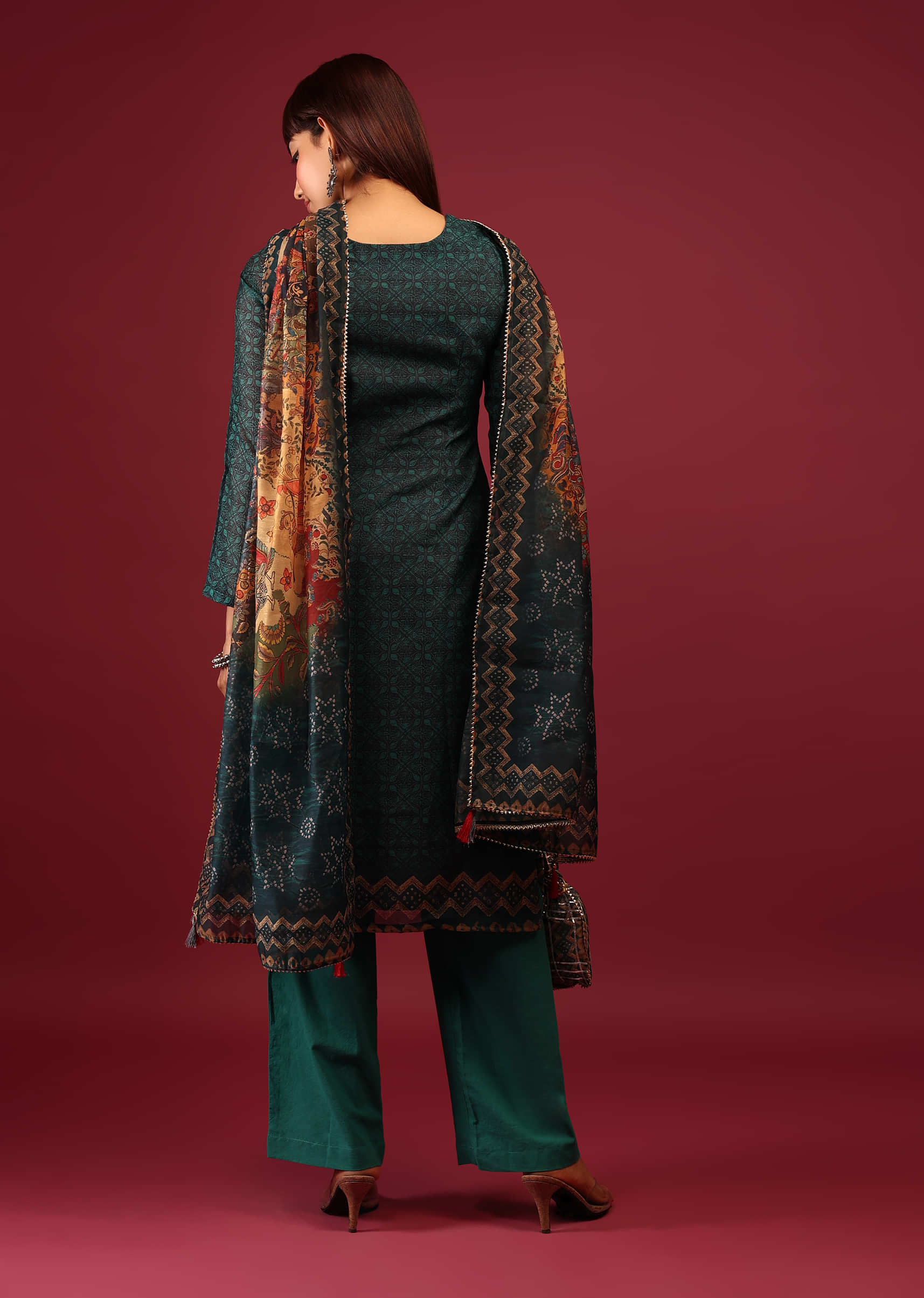 Deep Green Palazzo Suit In Tussar Silk With A Stunning Potli Bag