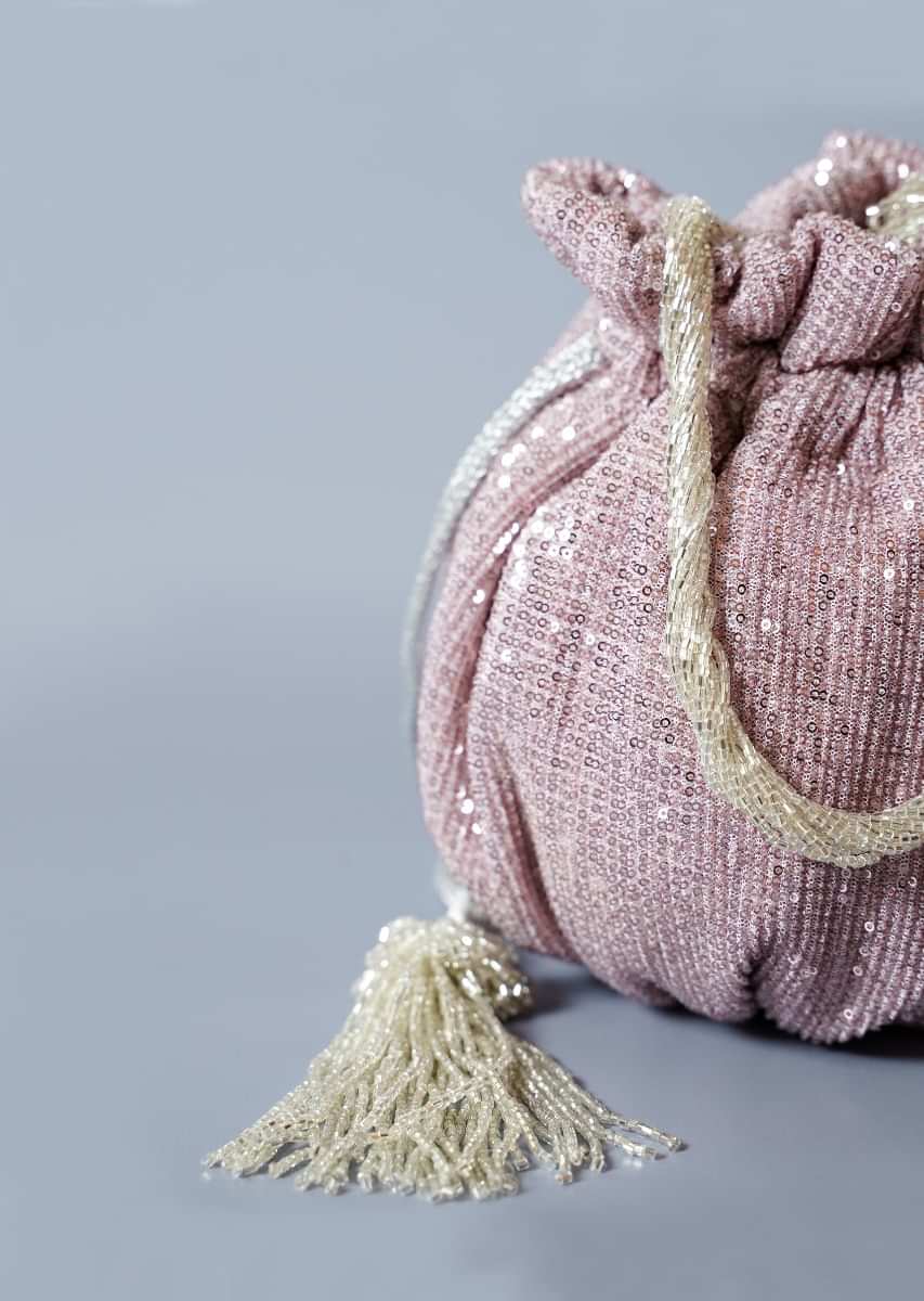 Lavender Potli Bag In Sequins Fabric With Cut Dana Tassels And Handle By Solasta