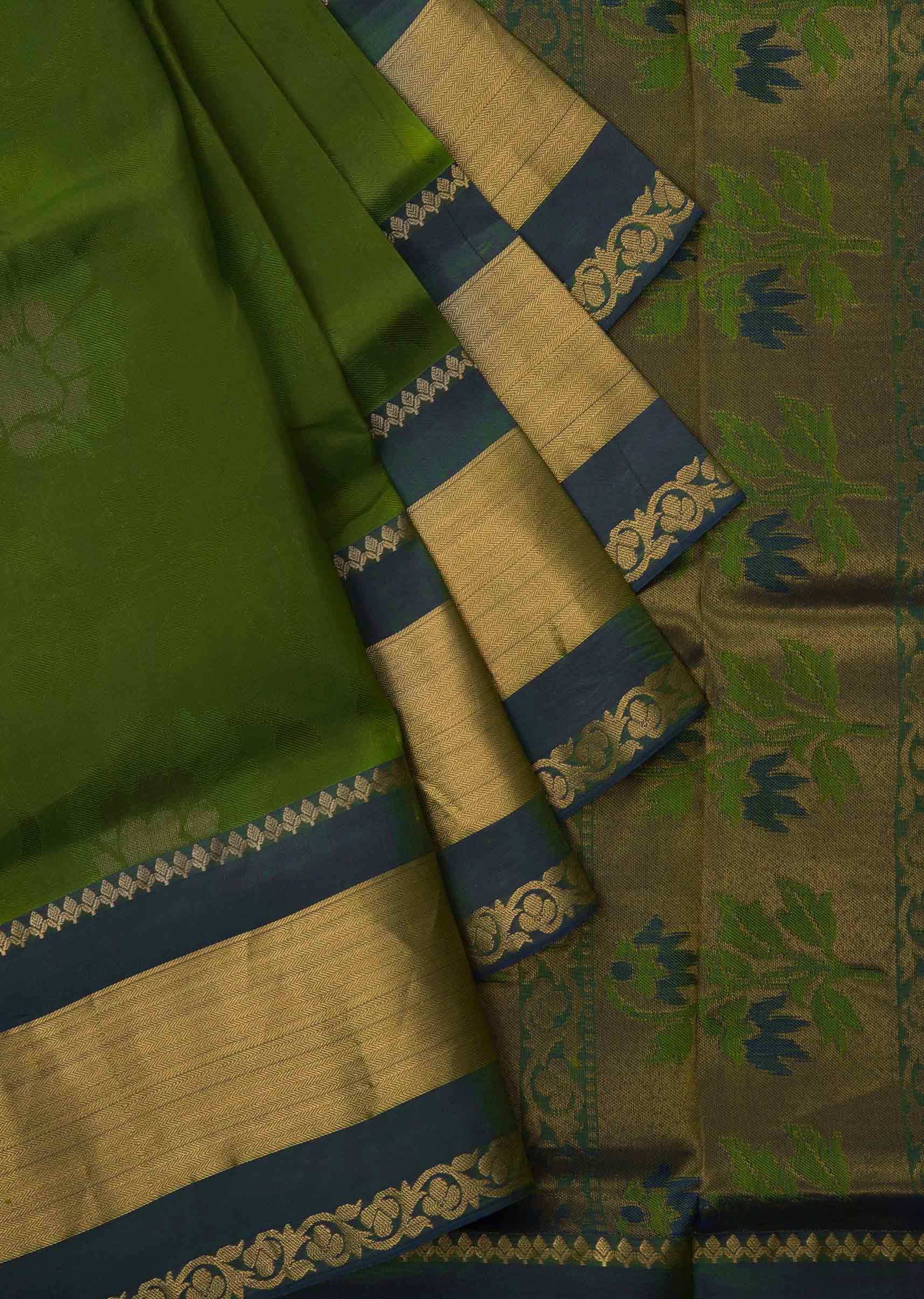 Leaf green saree in silk beautified in weaved embroidery only on Kalki