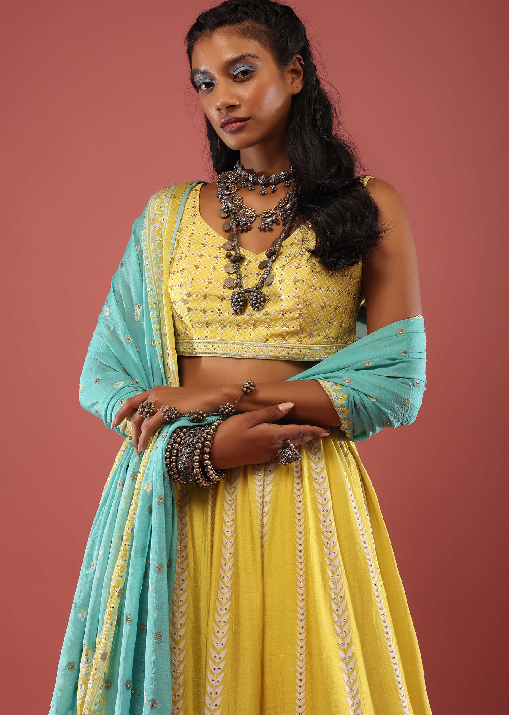 GREEN MULTI COLOURED BANARASI LEHENGA SET AND A CLASSIC MIRROR EMBROIDERED  BLOUSE PAIRED WITH A FOREST GREEN BANARASI DUPATTA AND GOLD DETAILS. -  Seasons India