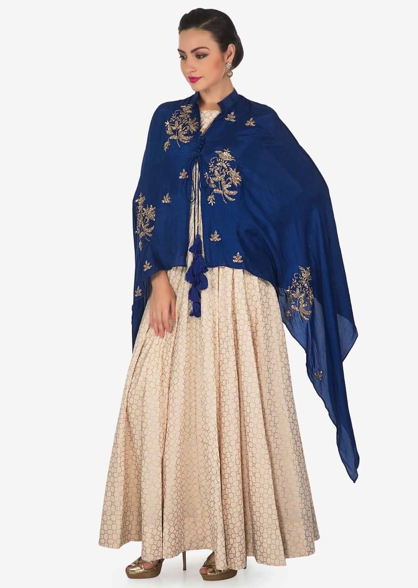 Cream Anarkali Suit Matched With Royal Blue Embroidered Fancy Cape Online - Kalki Fashion