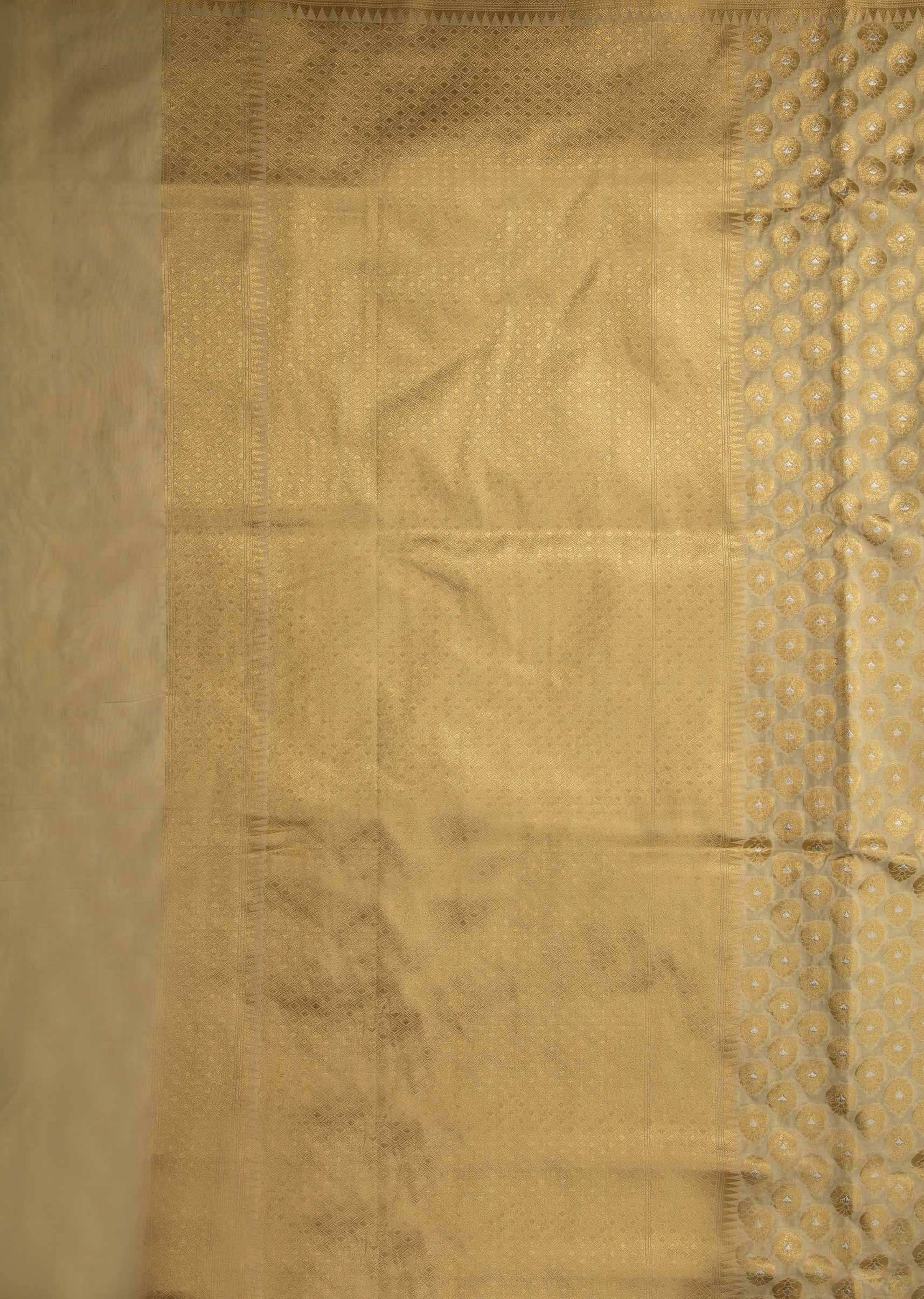 Light cream chanderi silk saree with weaved butti and geometric motif pallav border