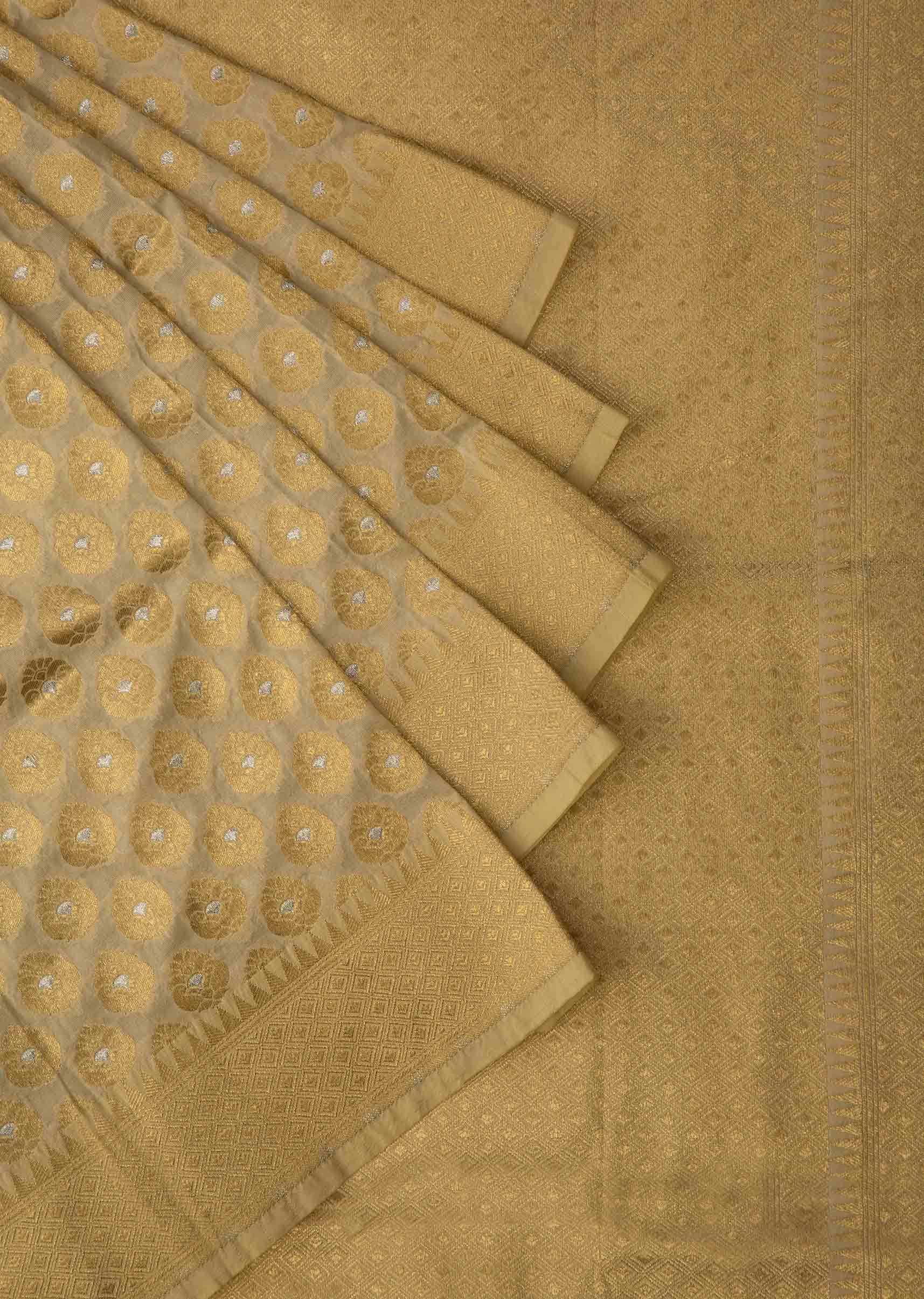 Light cream chanderi silk saree with weaved butti and geometric motif pallav border