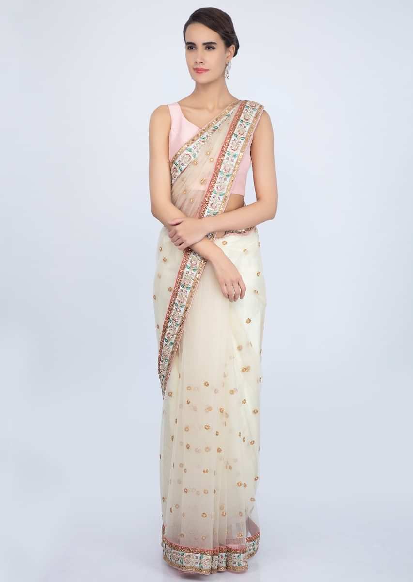 Light Cream Saree In Net With Floral Embroidered Butti And Border Online - Kalki Fashion
